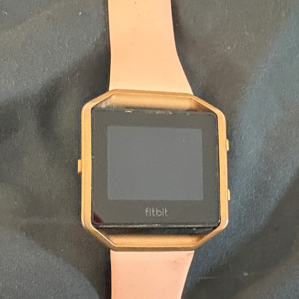 Fitbit Smartwatch With Gold Frame Pink Band And Charger